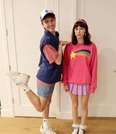 two people standing next to each other in front of a door wearing matching outfits and shoes