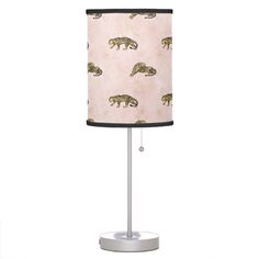 a pink lamp with brown bears on it and a black shade for the lampshade