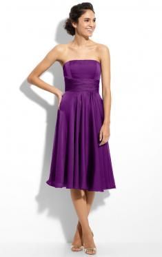 a woman in a strapless purple dress