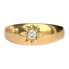 This classic style band is modelled in 9carat gold and the old mine cut diamond which is set in the star setting measures 20pts. Size: U or 10 Width: 7.5mm Weight: 4.8g Classic Yellow Gold Star-shaped Diamond Ring, Classic Star-shaped Formal Jewelry, Classic Star-shaped Jewelry With Single Diamond, Classic 14k Gold Star-shaped Diamond Ring, Classic Star-shaped Diamond Ring, Classic Star-shaped Diamond Anniversary Ring, Classic Star-shaped Ring For Formal Occasions, Gold Star-shaped Diamond Ring For Formal Occasions, Starburst Diamond Ring