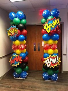 two tall balloon columns decorated with comic balloons