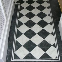 a black and white checkered floor in a hallway