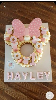 a minnie mouse cookie with the word h is for hayley