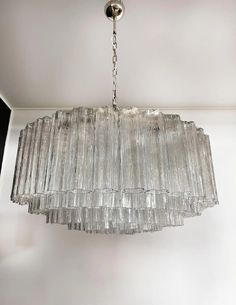 a glass chandelier hanging from the ceiling