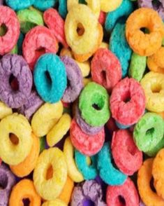 there are many different colored donuts together