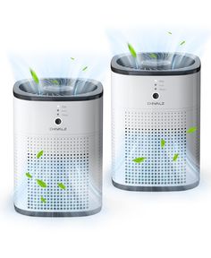 two white and black speakers with green plants coming out of the top, on a white background