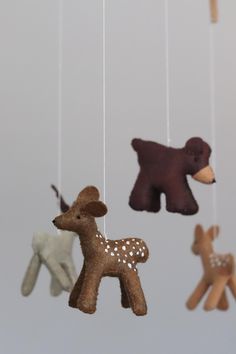 several small stuffed animals hanging from strings