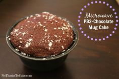 microwave pb2 chocolate mug cake with sprinkles in a black bowl