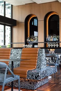 two chairs sitting in front of a bar