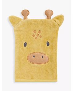 a yellow towel with a brown animal face on it's side and ears sticking out