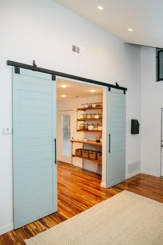 an open door leading into a room with wooden floors