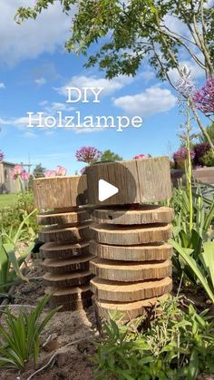 a pile of wood sitting in the middle of a garden with text overlay that reads diy hollampe