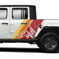 the side view of a white jeep with an orange and yellow design on it's side