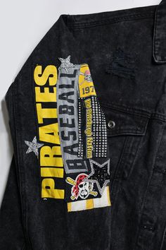 a black jean jacket with pittsburgh pirates on it