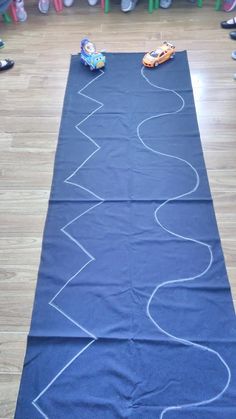 a long blue rug with cars on it