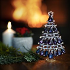 a small christmas tree is sitting on a table