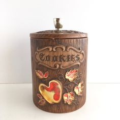 an old fashioned cookie jar with the word cookies painted on it