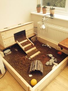 a wooden box filled with dirt and rocks