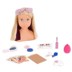 the doll is next to her hairbrush and other accessories