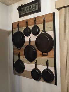 pots and pans are hanging on the wall