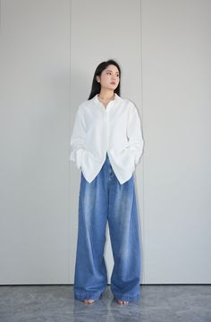 Embrace comfort and style with our classic vintage wide-leg jeans, a timeless addition to any wardrobe. Crafted from high-quality denim, these jeans are not only durable but also add a touch of personal flair. The high-waisted design enhances the silhouette, while the loose leg cut offers extra room for movement. Versatile for both casual and formal occasions, these jeans are flattering for all body types. Color： White Material： 100%Cotton ninido is wearing size M White Shirt And Pants Outfit, White Flair Jeans Outfit, Shirt With Wide Leg Jeans, Blue Jeans And White Shirt, White Wide Leg Jeans Outfit, Professional Jeans, Flair Jeans Outfit, Loose Jeans Outfit, White Denim Outfit