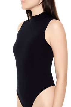 Knit bodysuit featuring mock neck, sleeveless cut, and thong bottom cut. | 61% polyester, 33% cotton, 6% spandex | Hand wash cold | Model is 5'10" and wearing Small | Mock Neck Thong Bodysuit Knit Bodysuit, Mock Neck, Hand Wash, Spandex, Knitting, How To Wear