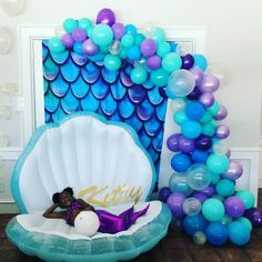 a mermaid themed birthday party with balloons and decorations