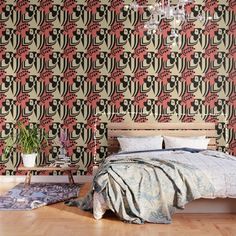 a bed sitting in front of a wall with a chandelier hanging from it