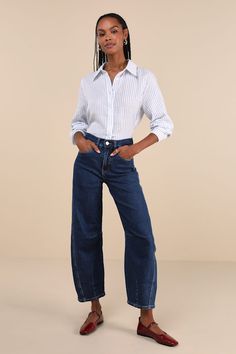 Curate a stylish look that's perfectly trendy with the help of the Blank NYC The Franklin Dark Wash High-Rise Barrel Jeans! Slightly stretchy denim shapes these covetable and cool pants that have a high waist, belt loops, a five-pocket cut, and a hidden zip fly with branded top button closure. Barrel-style legs with seamed knees finish at ankle-length hems. Fit: This garment fits true to size. Length: Ankle length. Size 28 Inseam: 27.00 Front Rise: 12.00 Waist: Fitted - very fitted at natural wa Trendy Stretch Jeans For Business Casual, Fitted Jeans For Business Casual Summer, Chic Stretch Jeans For Business Casual, Relaxed Fit Denim Pants For Business Casual, Trendy Denim Bottoms For Business Casual, Chic Denim Pants For Business Casual, Chic Spring Jeans For Business Casual, Chic High Rise Straight Fit Bottoms, Chic Tapered Leg Jeans For Business Casual