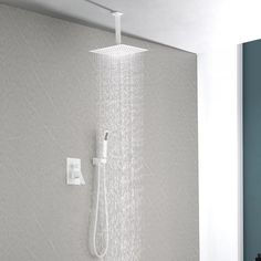 a shower head and hand held shower faucet in a bathroom