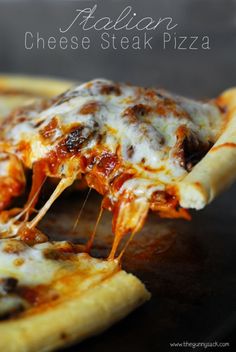 a slice of pizza is being lifted from the plate