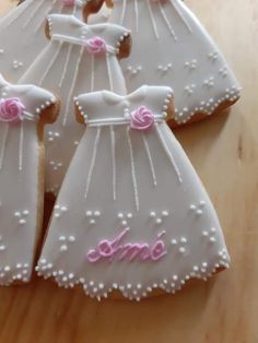 some decorated cookies are sitting on a table