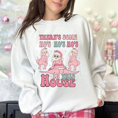 Funny Christmas Sweatshirt. There's Some Ho Ho Hos in This House Crewneck Sweatshirt. Inappropriate Christmas Crew, Women's Ugly Christmas Sweater DETAILS Our sweatshirts are SUPER soft and SUPER comfy. They do RUN BIG! Make sure to choose your size according to the size chart measurements! FABRICATION 8 oz., 50% Cotton/ 50% Polyester -- Preshrunk -- Double needle stitching at shoulder, armhole, neck, waistband and cuffs CARE INSTRUCTIONS Machine wash Tumble dry low Do not iron directly on design PERSONALIZATION We absolutely love customizing orders for people! The best feeling is being able to add a personal touch to our designs to make our customers happy. If you would like a personalized item please send us a message and we will make it happen! SHIPPING There are shipping upgrades you c Christmas Sweatshirt Ideas, Sweater Details, Wifey Sweatshirt, Ugly Christmas Sweater Women, Christmas Pullover, Oversized Graphic Tee, Halloween Sweater, In This House