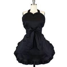 a black dress on a mannequin with a bow at the waist and back