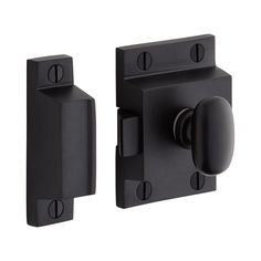 a black door handle with two knobs on it's side and an open one in the middle