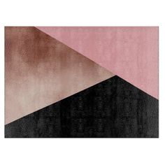 a pink and black rug with different shapes