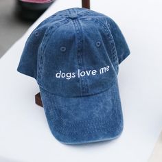 It's something to be proud of, honestly, and it's even better when everyone else knows it. With this "Dogs Love Me" hat, you're sure to be turning heads – especially those with floppy ears and four legs. Floppy Ears, Dogs Love, Embroidered Hat, Embroidered Hats, Brass Buckle, Be Proud, Hunter Green, Four Legged, Denim Blue