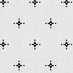 black and white dots are arranged in the shape of an x on a sheet of paper