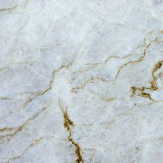 an image of white marble with gold veining