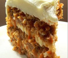 a piece of carrot cake with white frosting on top and the words best carrot cake ever above it