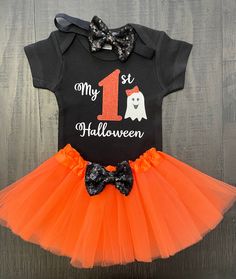 Celebrate babies 1st Halloween by letting her wear this adorable outfit!! You will receive all 3 pieces when purchased including the bodysuit, tutu and headband. The bodysuit is made with great quality vinyl that is applied with a heat press at the proper temperature and pressure. It can be made in short or long sleeves The tutu has a stretchy waistband and the bow is sewn onto it. The tutu has 3 layers of tulle.  The headband is made with soft stretchy elastic and the bow is attached to the elastic. The bow is made with small sequin pieces.  0/3m fits 8-12 lbs 3/6m fits 12-16 lbs 12/18m fits 20-24 lbs Cute Black Halloween Costume, Cute Tutu Dress For Halloween Costume, Cute Halloween Party Costumes, Cute Halloween Costume Tutu Dress, Spooky One Outfit, Spooky One Birthday Outfit, Fitted Tutu Dress For Birthday Halloween, Cute Halloween Tulle Tutu Dress, Baby Girl Halloween Outfit