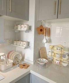 the kitchen counter is clean and ready to be used for baking or serving dishes with utensils on them