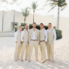 a group of men standing next to each other in the snow