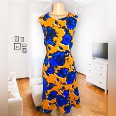 Brand New Dress From Who What West Stunning Deep Yellow Color With Blue And Black Floral All Over Print Size Small. Fits More Like A Size 6 Model Is 5”2 Sleeveless Stretch Midi Dress With Floral Print, Stretch Sleeveless Midi Dress With Floral Print, Yellow Fitted Floral Print Sleeveless Dress, Yellow Printed Sleeveless Midi Dress, Fitted Yellow Floral Print Sleeveless Dress, Fitted Yellow Sleeveless Dress With Floral Print, Yellow Floral Print Sleeveless Midi Dress, Yellow Sleeveless Midi Dress With Floral Print, Ruffle Tiered Dress