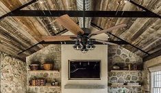 a living room filled with furniture and a ceiling fan