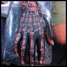 a person's hand with an intricate design on it