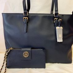 Buckled Handles And A Topstitched Hangtag Lend Classic Polish To The Spacious Julia Tote From Tommy Hilfiger. Extra-Large Sized Bag; 17-1/4"W X 11"H X 5-1/2"D (Width Is Measured Across The Bottom Of Handbag); 1.90 Lbs. Approx. Weight 9"L Double Handles Zip Closure Gold-Tone Exterior Hardware 1 Interior Zip Pocket & 3 Slip Pockets Laptop Compatible (Std. Size 13"-15") Faux Leather Imported Elegant Tommy Hilfiger Leather Shoulder Bag, Elegant Tommy Hilfiger Leather Bag, Elegant Tommy Hilfiger Shoulder Bag For Travel, Everyday Blue Tommy Hilfiger Shoulder Bag, Elegant Tan Tommy Hilfiger Bag, Elegant Tommy Hilfiger Tan Bag, Tommy Hilfiger Tote Bags, Tommy Hilfiger Bag, Tommy Hilfiger Handbags