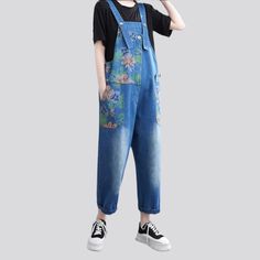 Take your style back to the future with our 2023 Summer Collection Y2K style medium wash painted jeans jumpsuit the perfect combination of vintage and trendy fashion! This one-piece wonder brings the slouchy silhouette of the early 2000s back to life with its unique flower print and sanded details.Distinctive Features Y2K Style: Channel your inner early 2000s with this vintage-inspired jumpsuit. featuring a baggy cut and a unique flower print. Painted Jeans: The medium wash painted jeans fabric Spring Streetwear Medium Wash Overalls, Spring Washed Blue Overalls, Spring Denim Blue Overalls For Streetwear, Spring Streetwear Denim Overalls, Spring Denim Overalls For Streetwear, Washed Blue Overall Jumpsuits And Rompers For Spring, Spring Washed Blue Overall Jumpsuits And Rompers, Trendy Blue Denim Overalls, Blue Denim Jumpsuit For Summer Streetwear