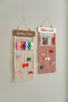 two wall hangings decorated with bows and ribbons