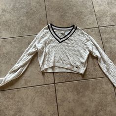 Women’s Size Small V-Neck Sweater, White With Navy Blue Stripes On The V-Neck Brand New With Tags Never Worn! Fitted V-neck Sweater For Loungewear, White Fitted V-neck Cropped Sweater, Trendy Cotton V-neck Knit Top, White Knit V-neck Crop Top, Trendy Knit V-neck Crop Top, Casual Stretch V-neck Sweater, Stretch Cotton V-neck Sweater, Trendy V-neck Crop Top For Loungewear, Casual Knit V-neck Crop Top